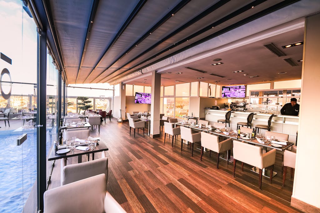 Man in Black Dress Shirt in Counter